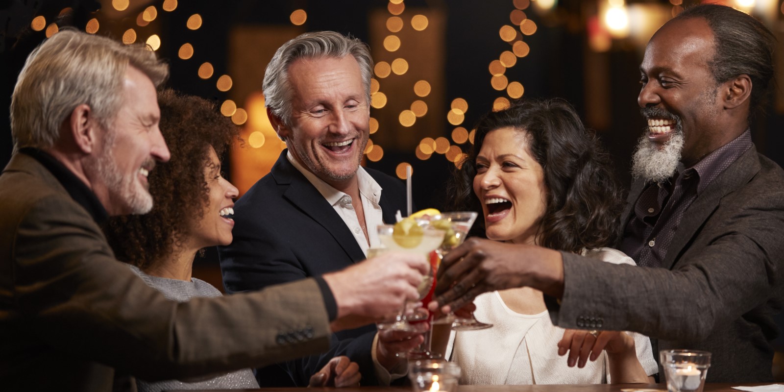 group of older friends sharing a toast