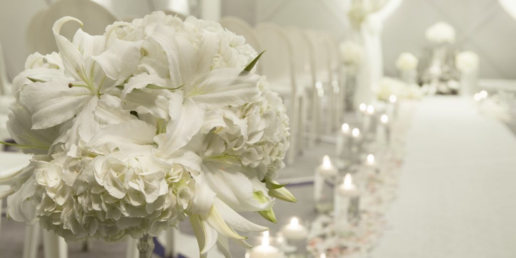 Wedding decor with white flowers and candle setting