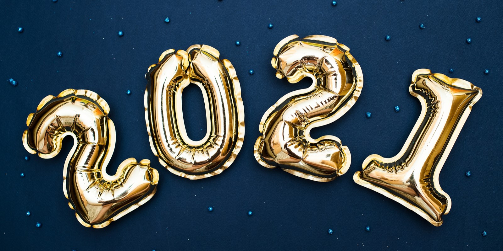 2021 Golden numbers 2021 from new year's balls of yellow metallic color on a blue
