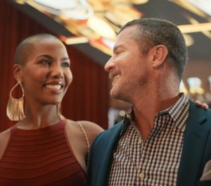 smiling couple walking out of bazaar meat