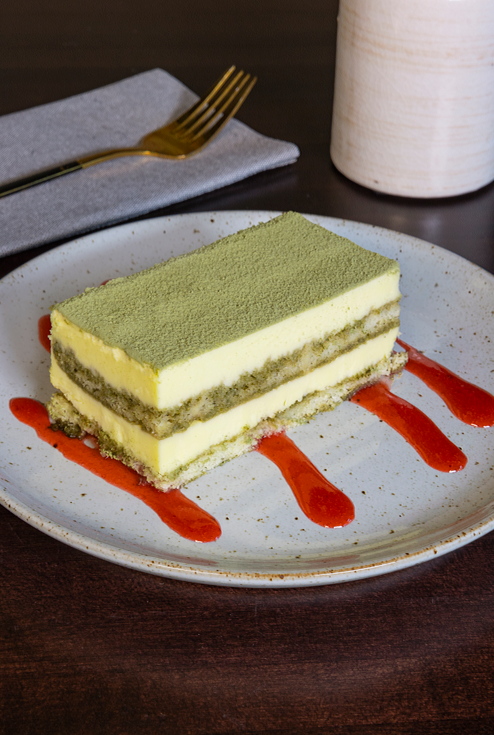 A Matcha dessert at The Noodle Den that looks like a cake