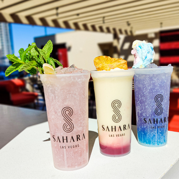 Three frozen pool drinks on display at a table