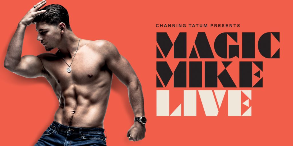 Male with top off and showing muscular abdomen is posing with the copy Magic Mike Live to his right