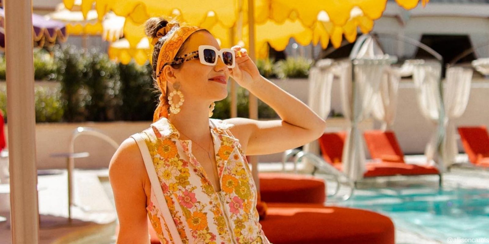 A woman with sunglasses by the pool