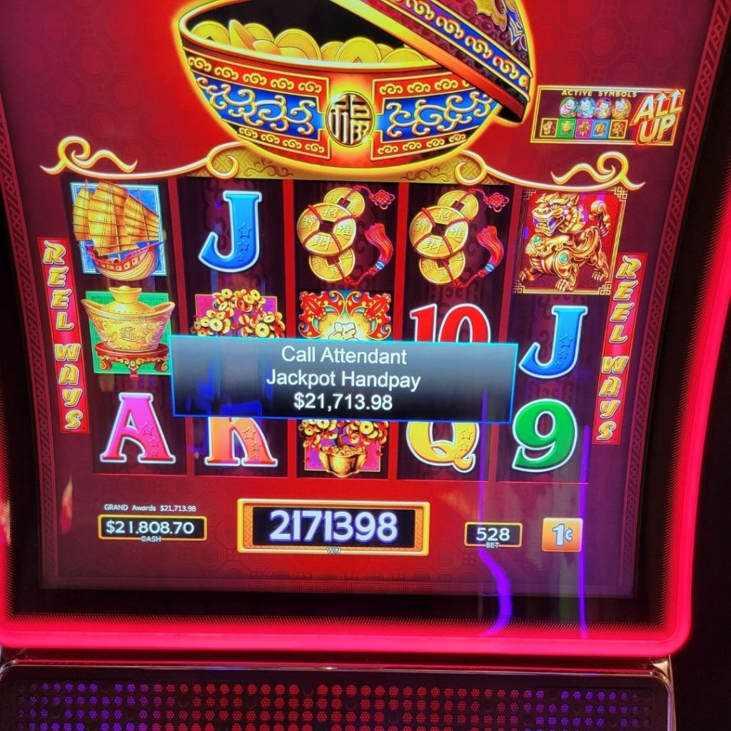Slot machine showing a jackpot win of over $15K