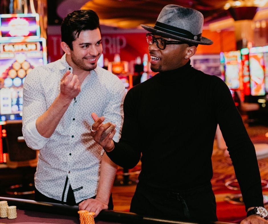 Two guys playing casino games together