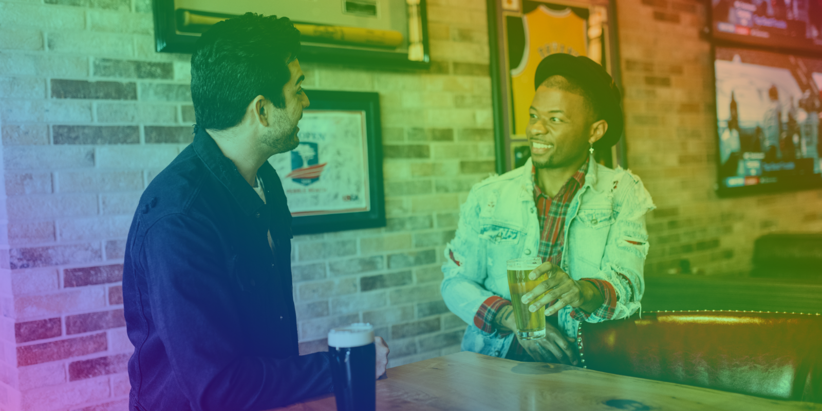 Two guys socializing over beer with a rainbow gradient over the image