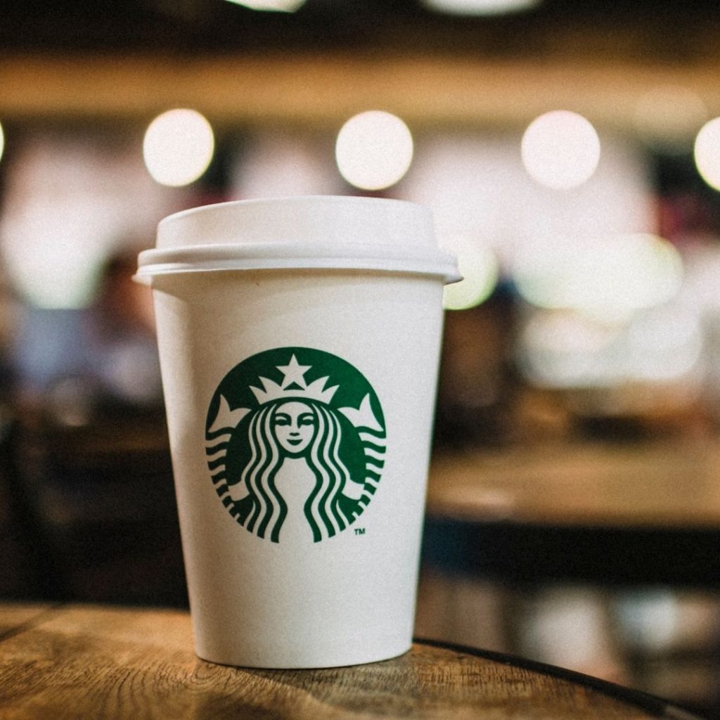 Starbucks cup sitting on a table