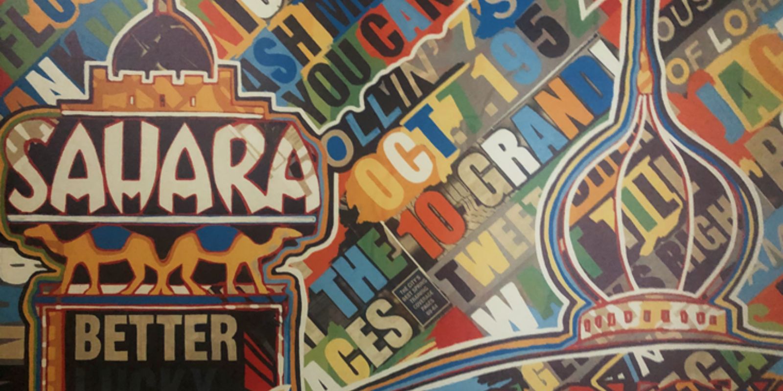 A picture of a painting from a hotel room that shows the old SAHARA logo, camels and is textured with lots of letters