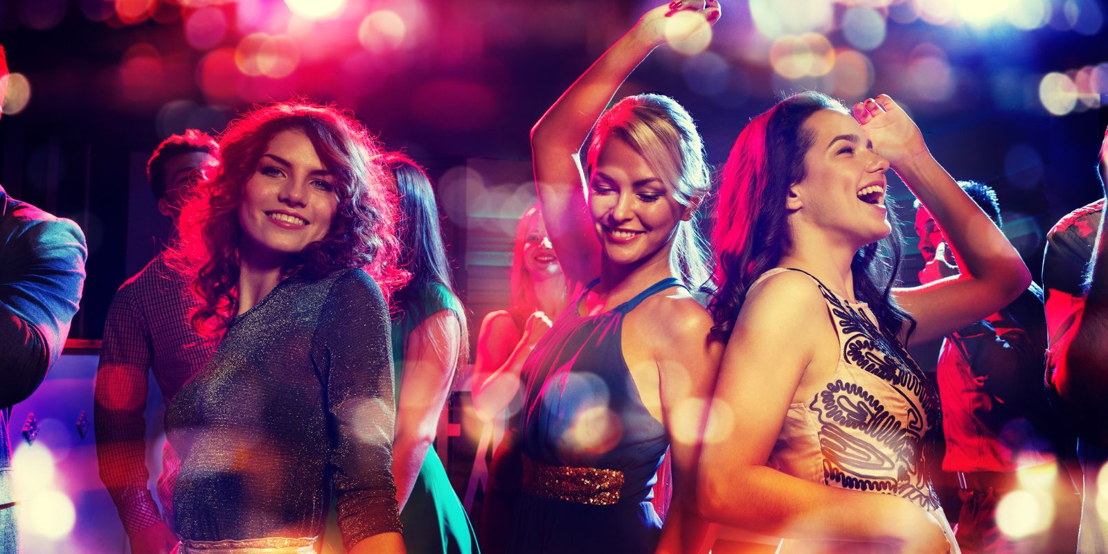 A group of women dancing at a club