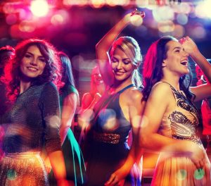 A group of women dancing at a club