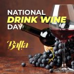 Balla National Drink Wine Day Picture with a bottle of red wine next to a glass filled with red wine.