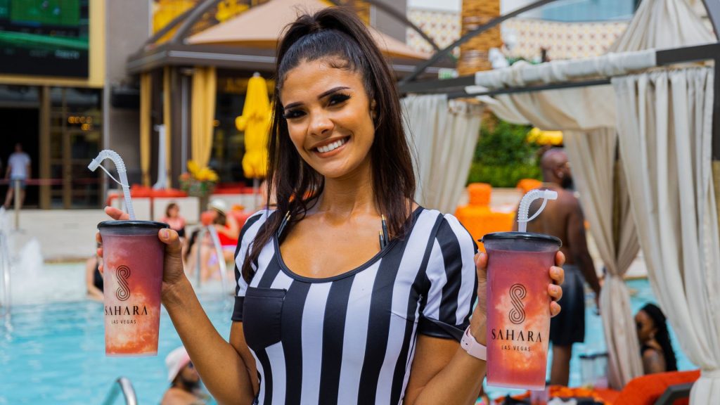 Girl holding drinks at AZILO Ultra Pool