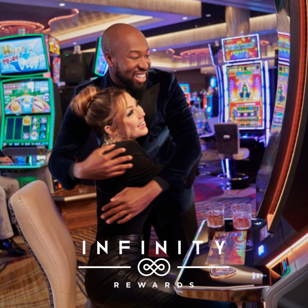 a couple playing slot machines