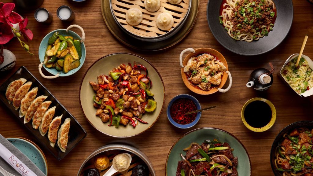 tablescape of food at The Noodle Den