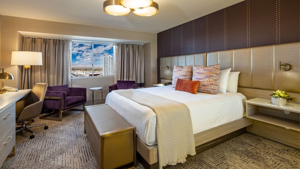 a picture of a marra style room with a king bed