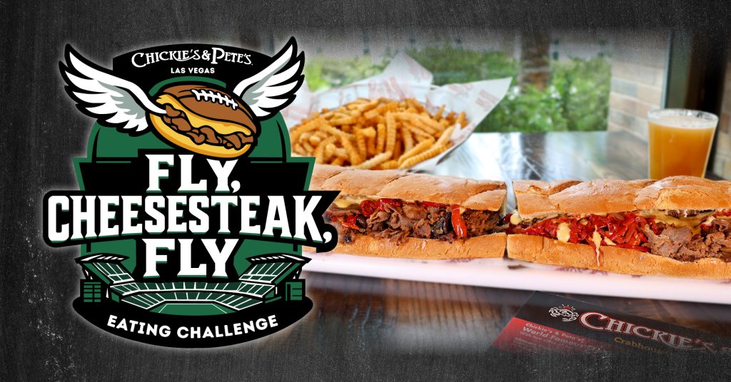 a picture of an eating challenge showing a huge sandwich and a beer